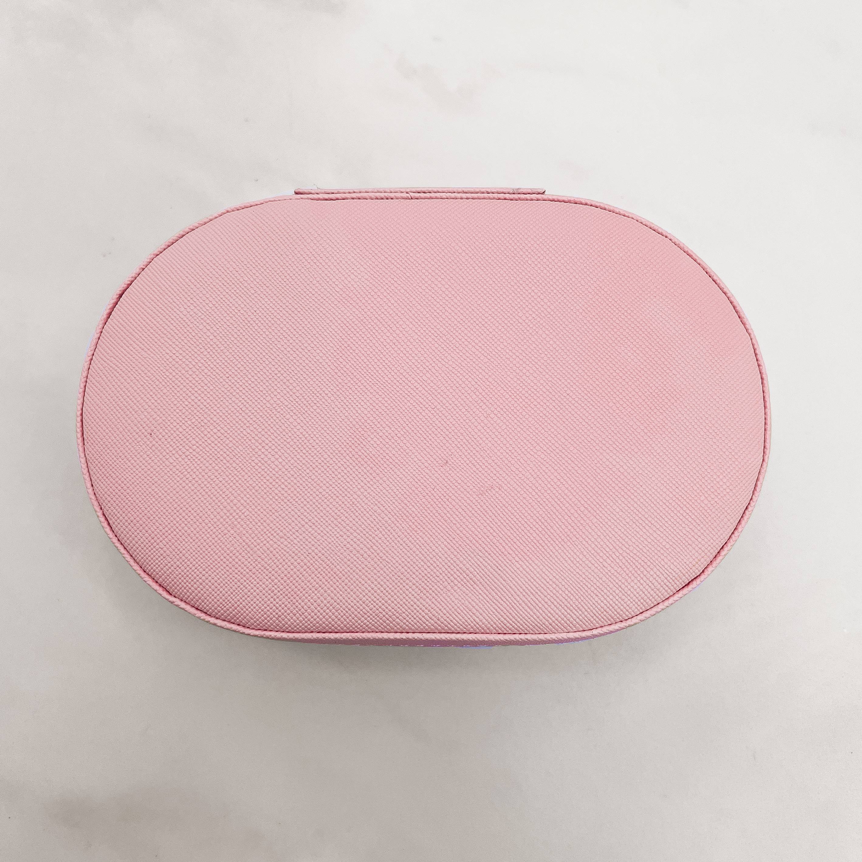 Imagem Porta-joias oval rosa 14x9x4cm zíper dourado