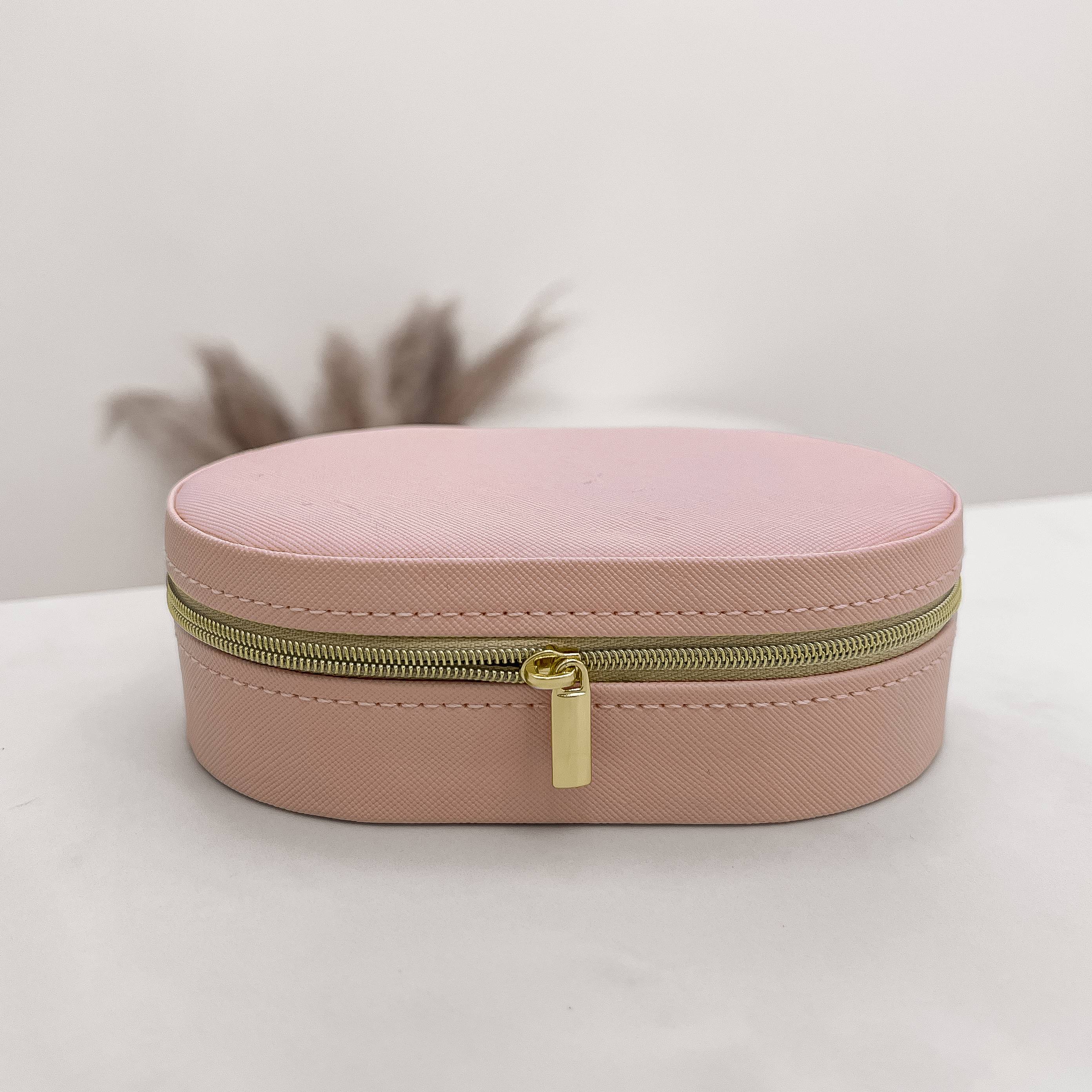 Imagem Secundária Porta-joias oval rosa 14x9x4cm zíper dourado