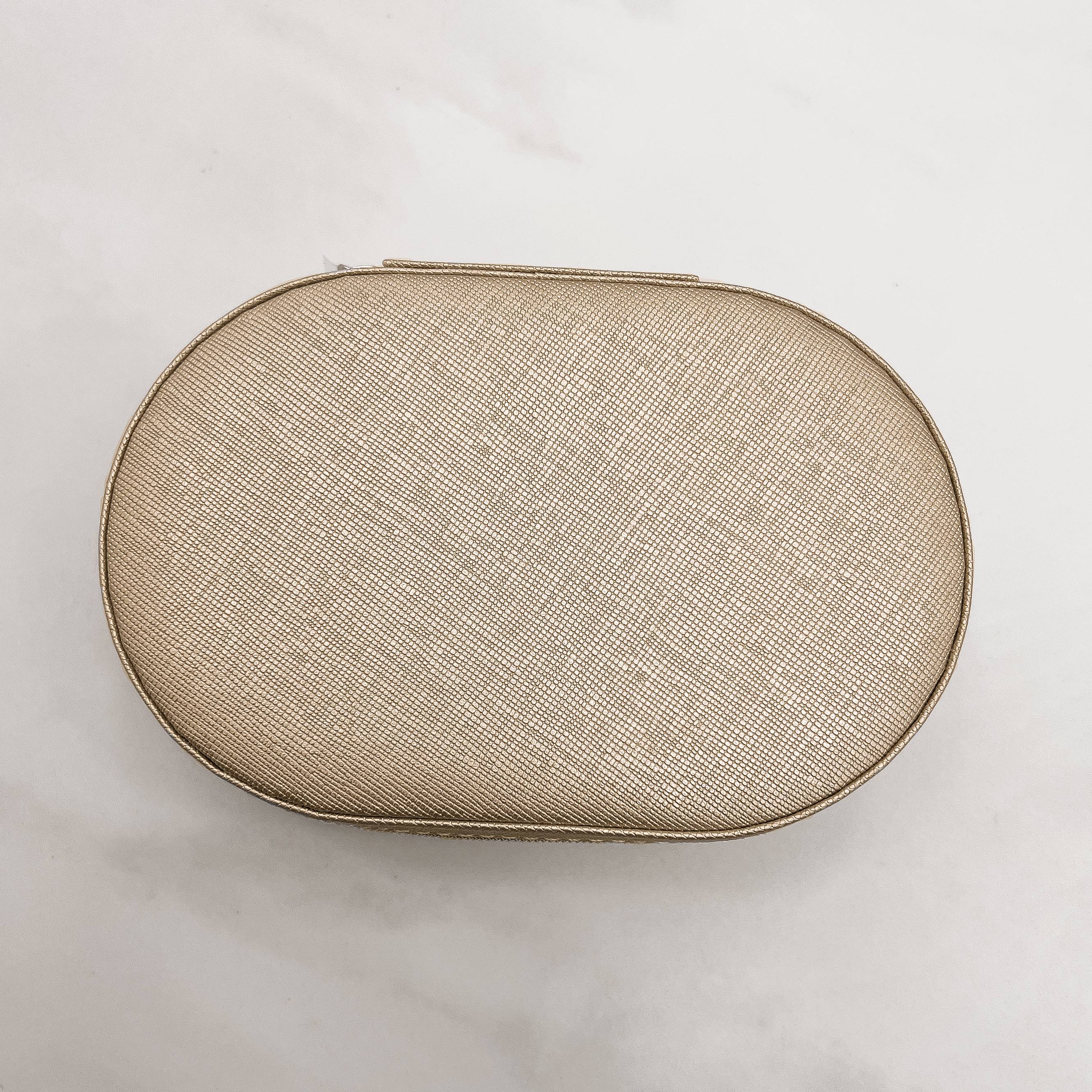 Imagem Secundária Porta-joias oval champanhe 14x9x4cm zíper dourado