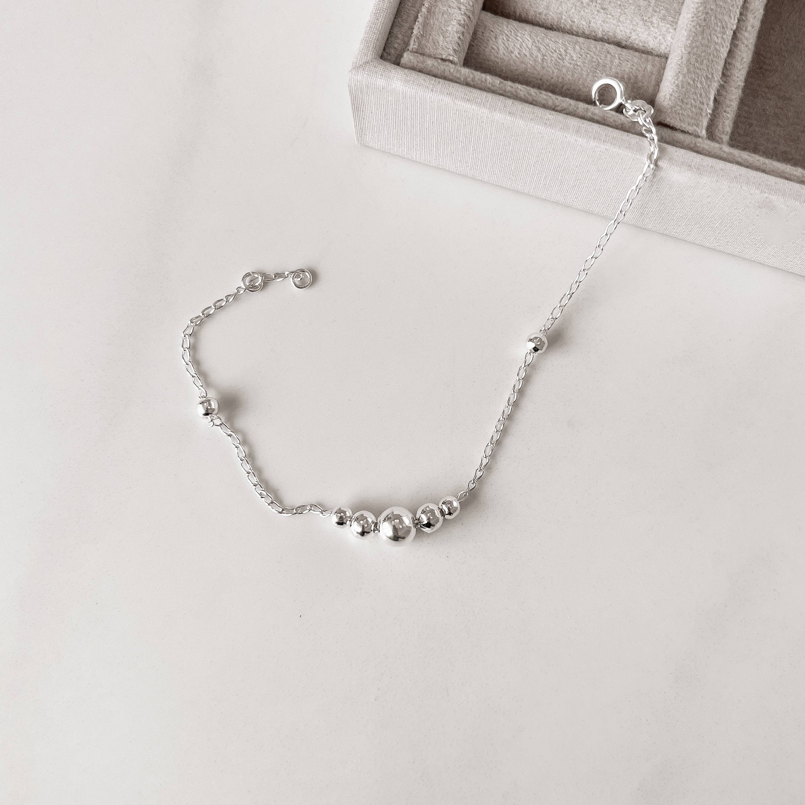 Pulseira entremeios bolas