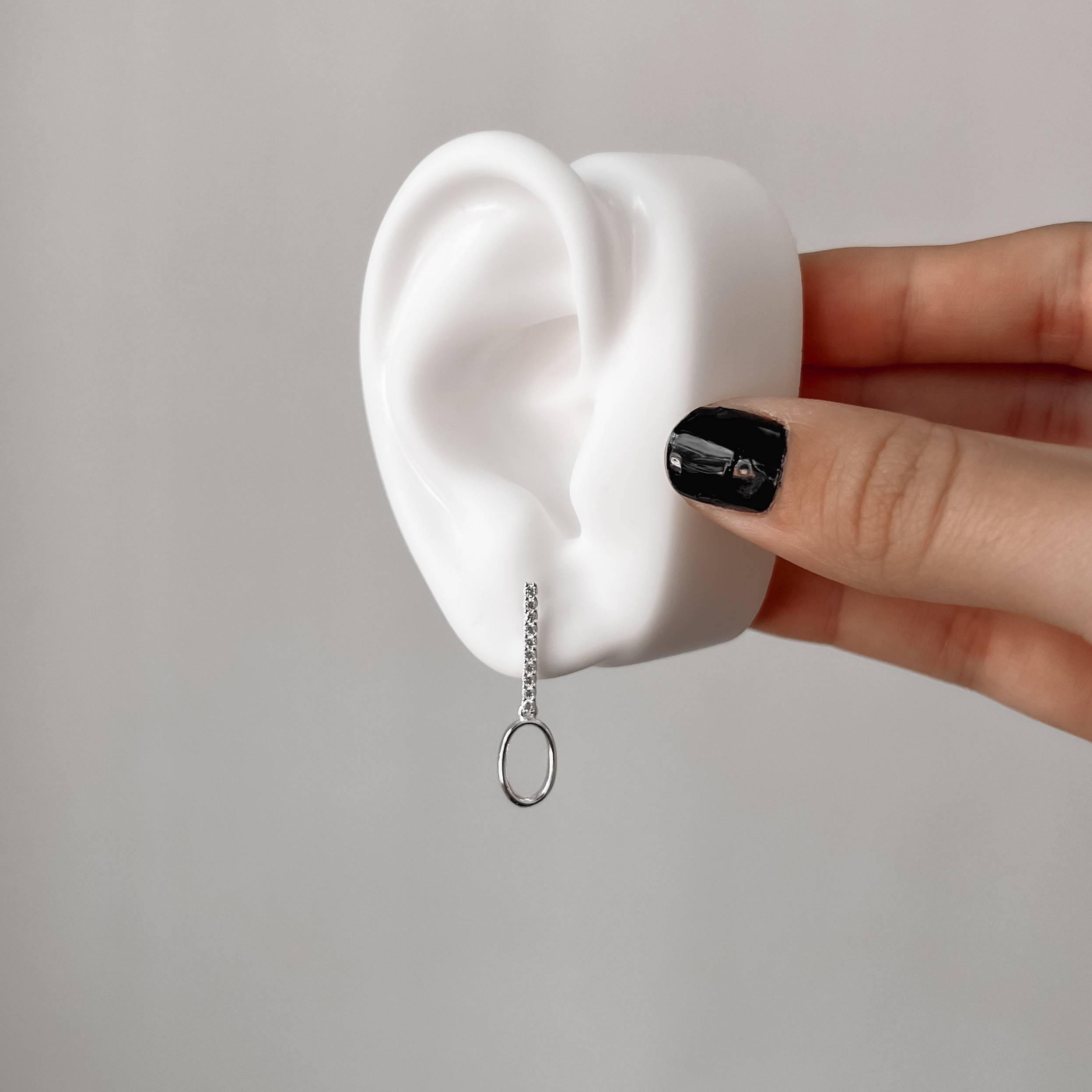 Imagem Brinco palito cravejado 17mm com pingente elo oval