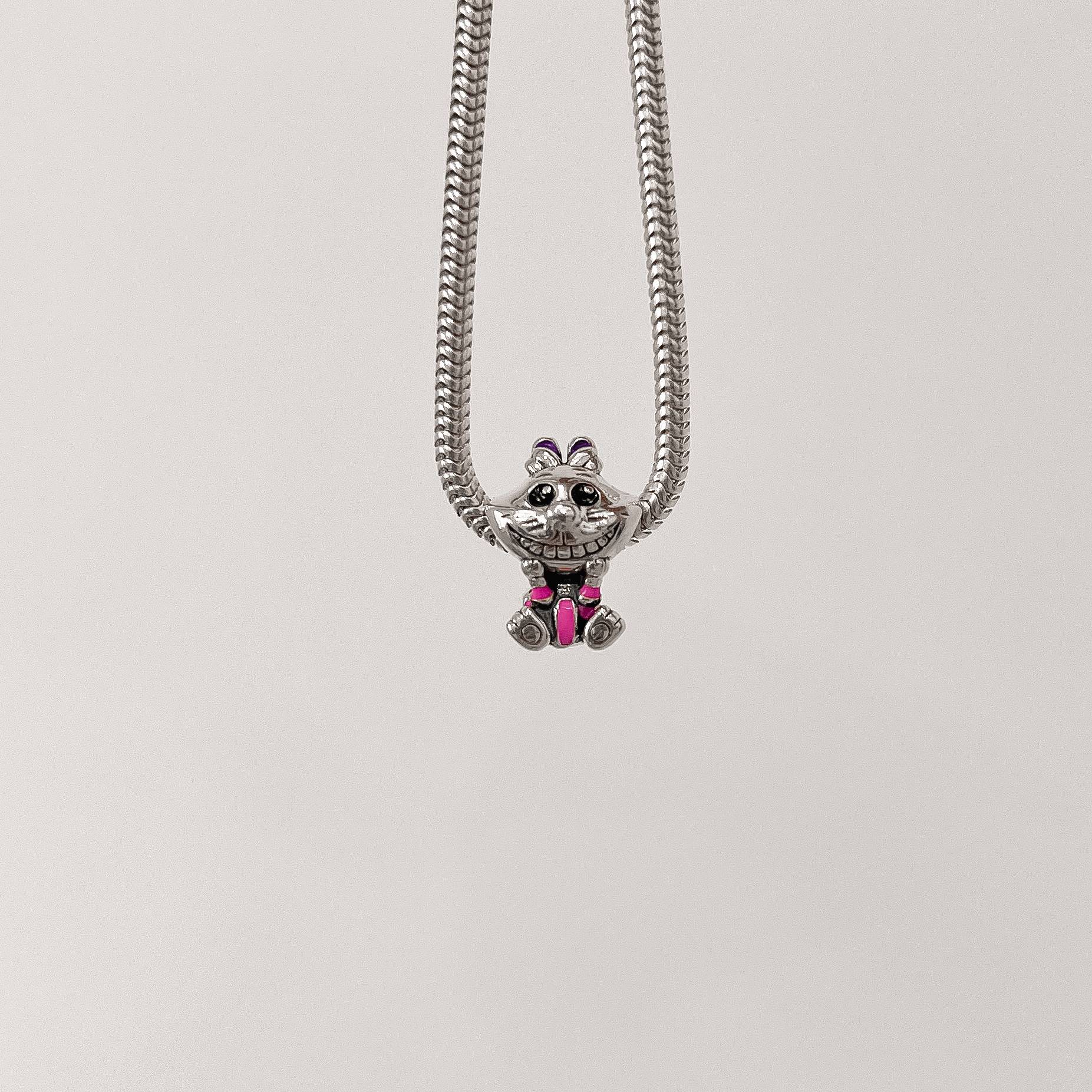 Imagem Berloque separador Gato de Cheshire resina 15mm envelhecido