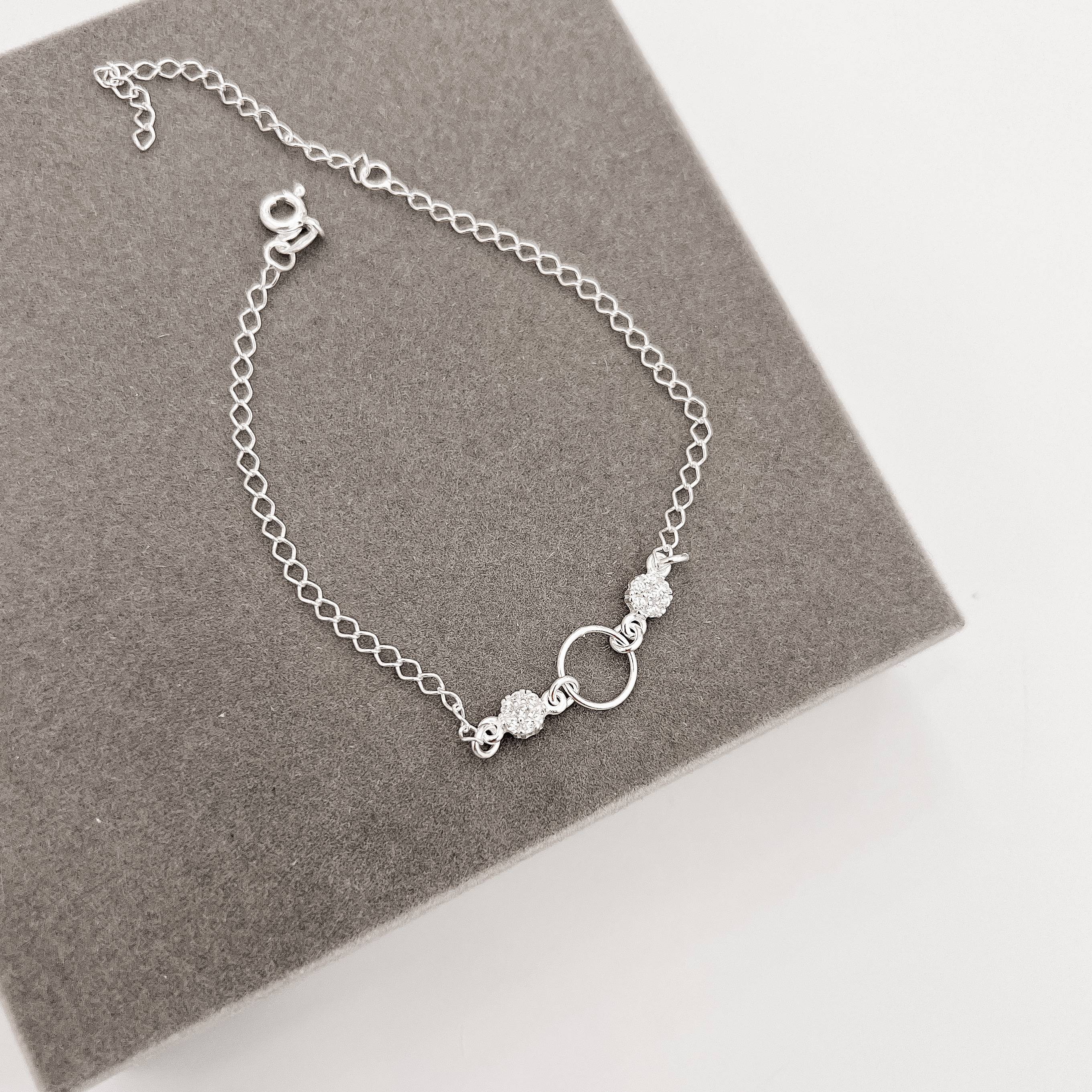 Imagem Secundária Pulseira entremeio círculo vazado 9mm com botões cravejados 18cm com alongadora