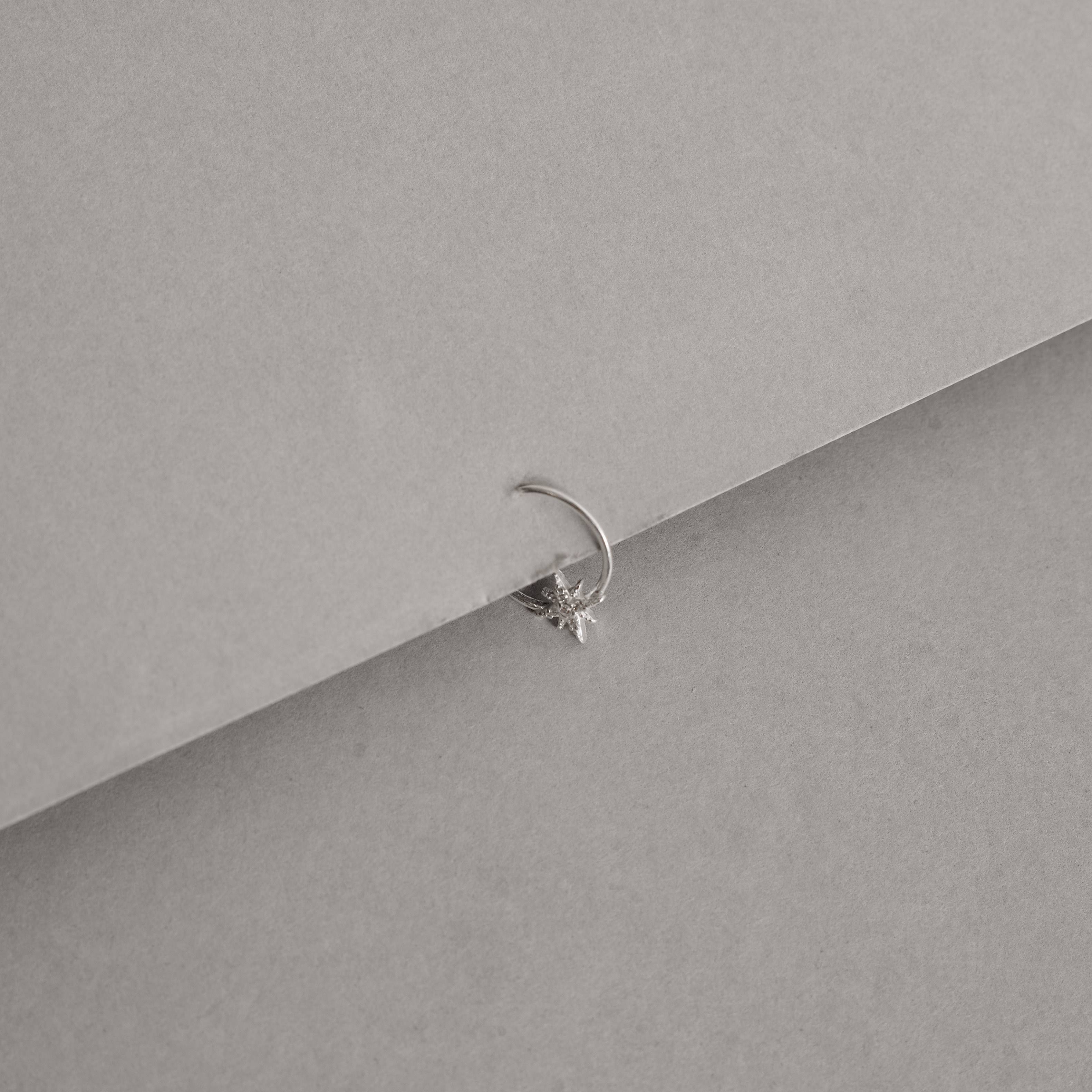 Imagem Secundária Piercing argola com estrela 8 pontas cravejada 11mm