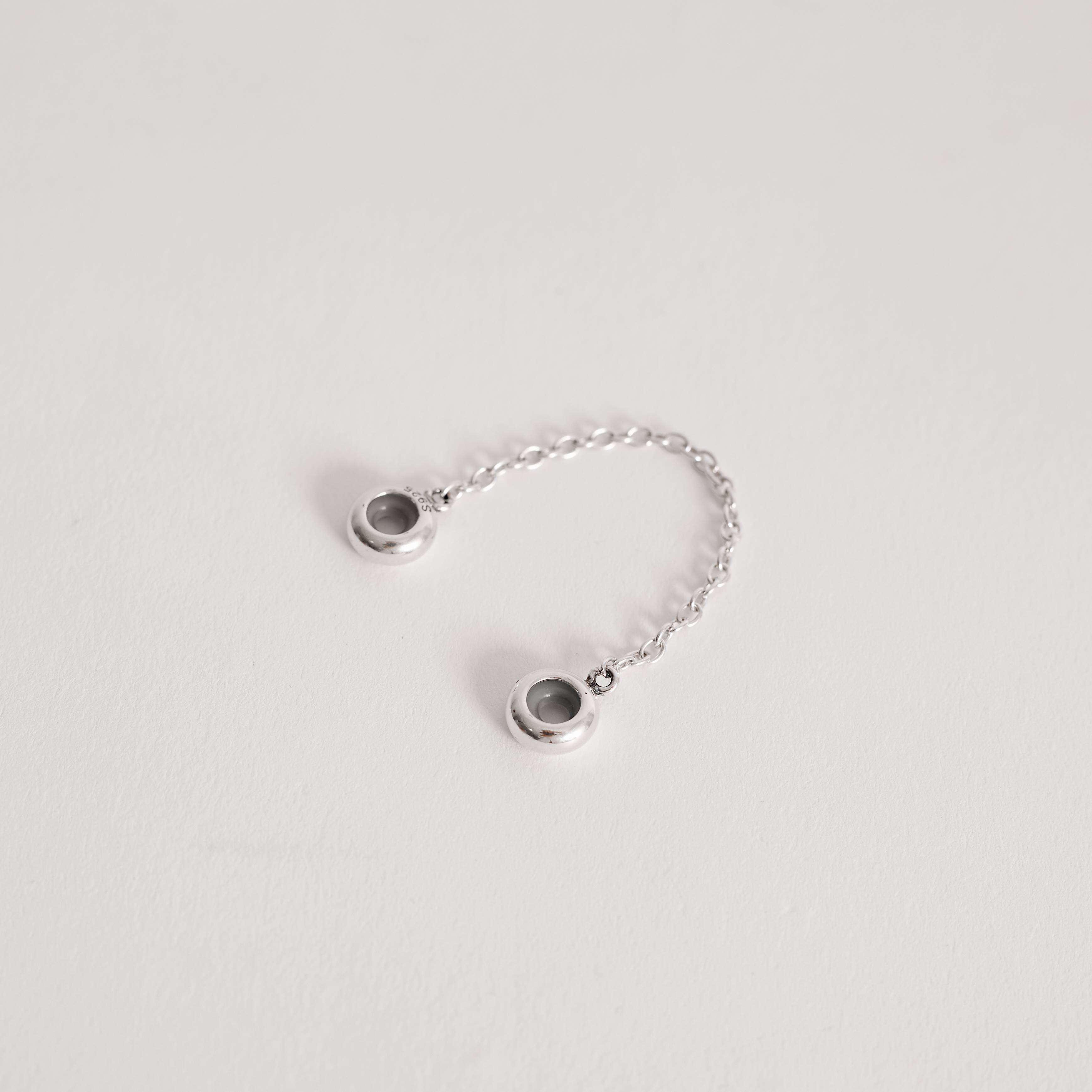 Imagem Berloque trava silicone envelhecido