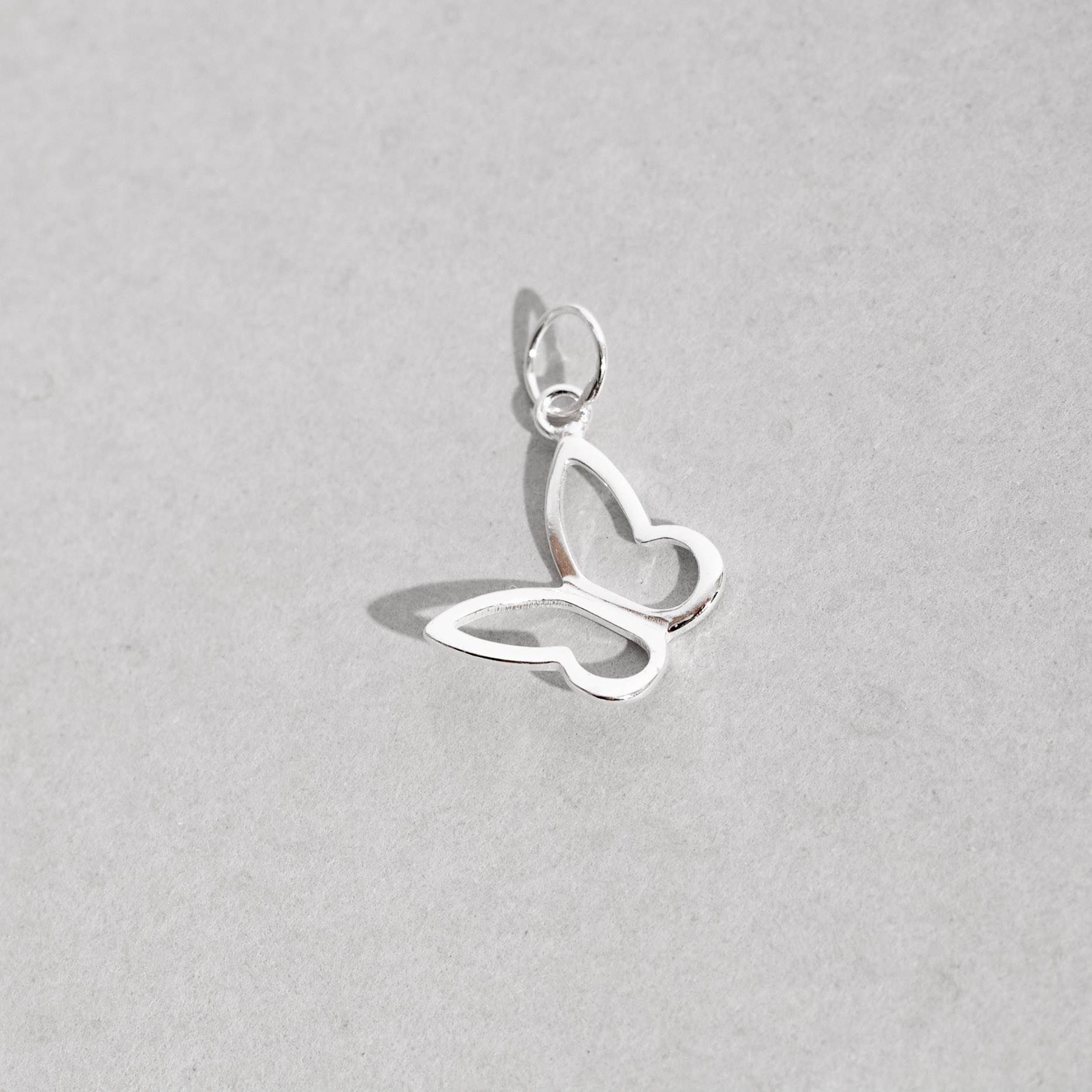 Imagem Secundária Pingente borboleta vazada de lado 11mm