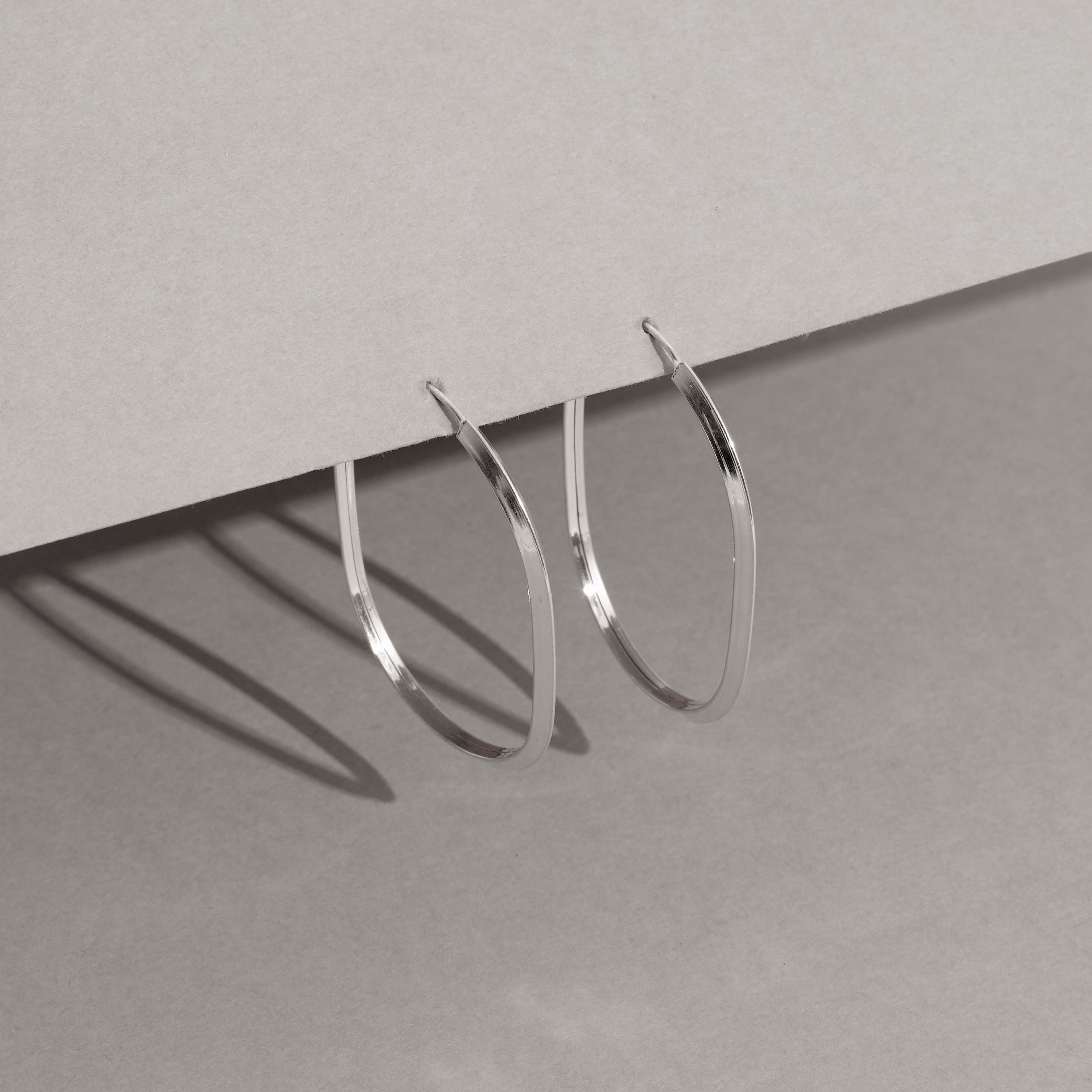 Imagem Secundária Argola oval 41x30mm fio triângulo