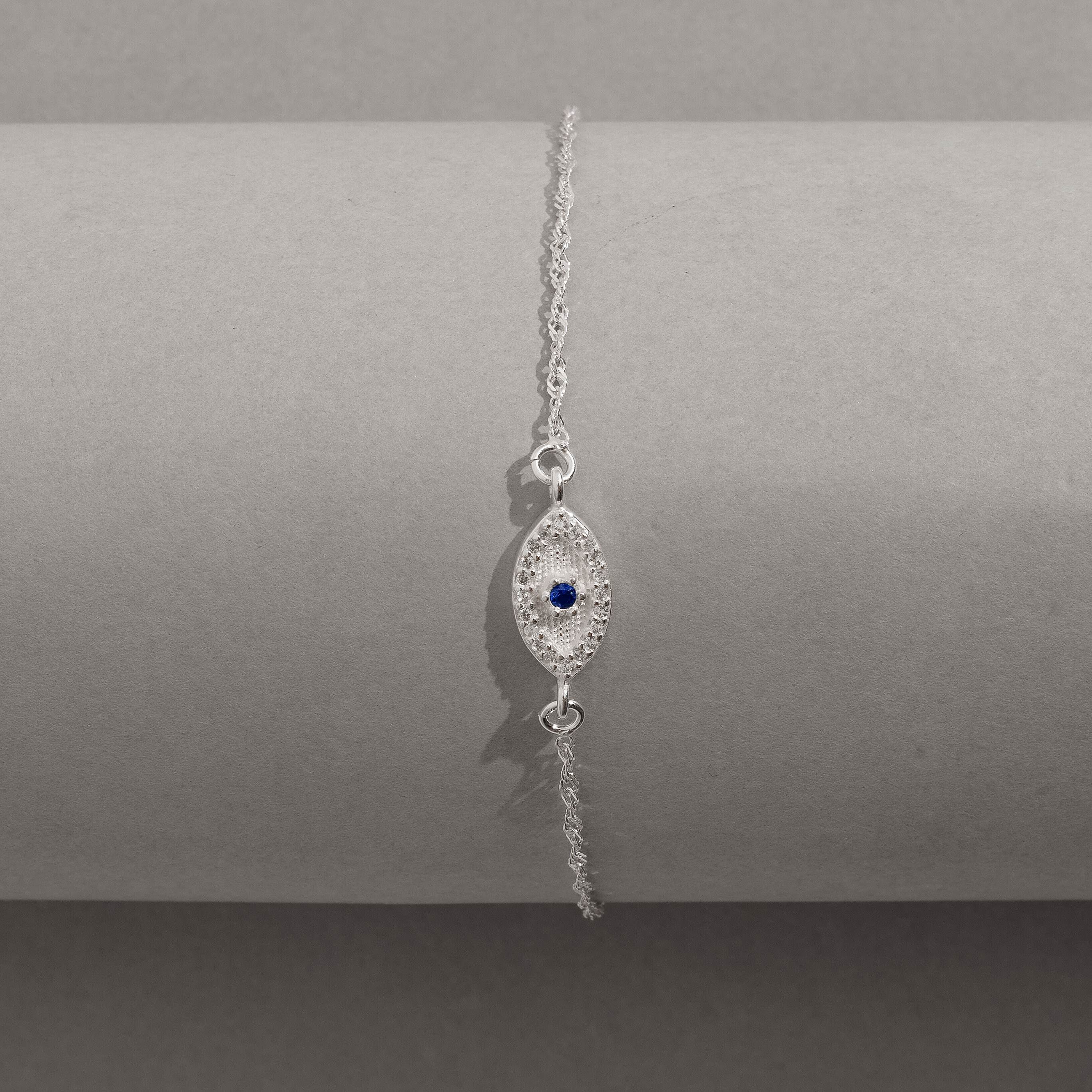 Pulseira entremeio olho grego cravejado 12mm corrente singapura