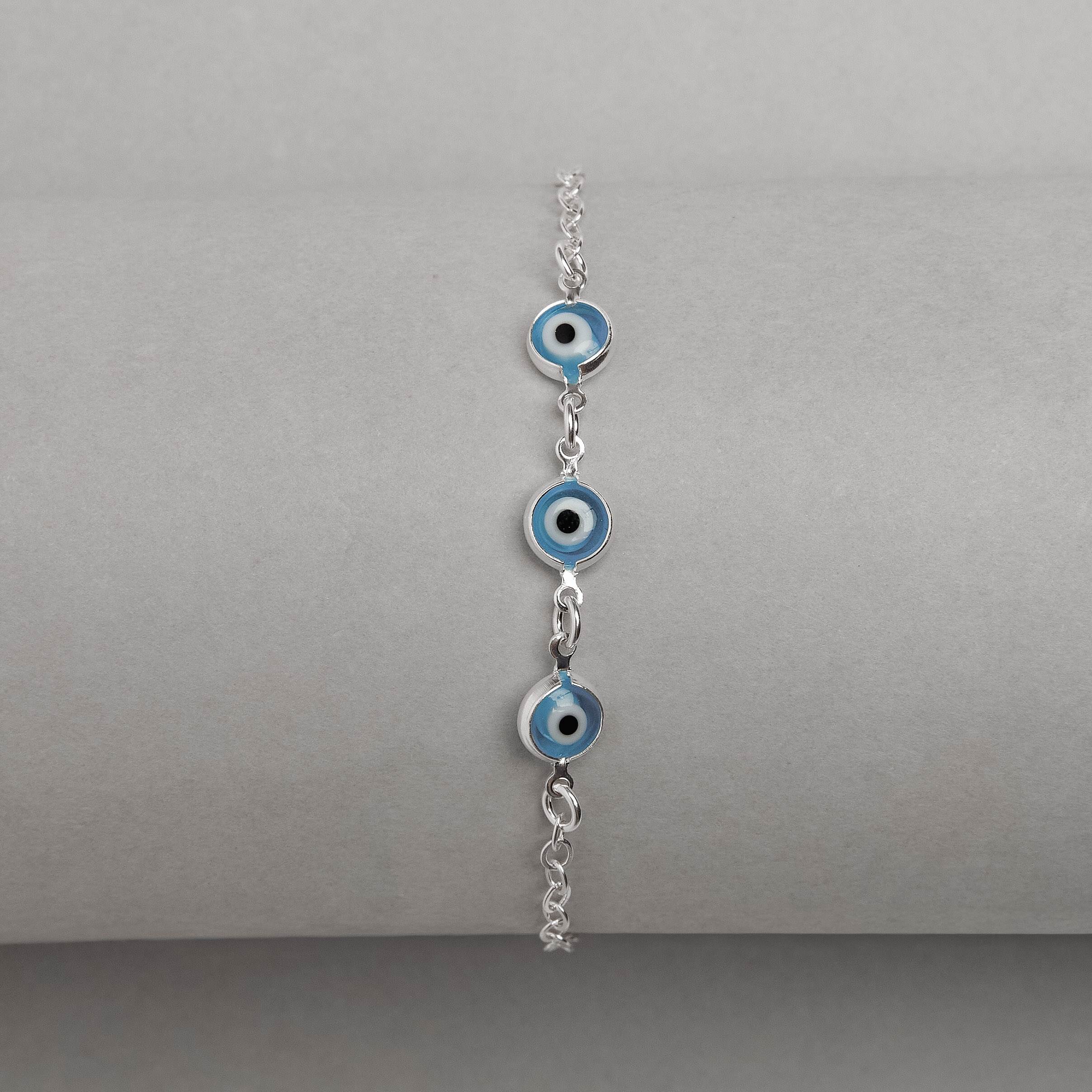 Imagem Secundária Pulseira entremeios olho grego azul 7mm