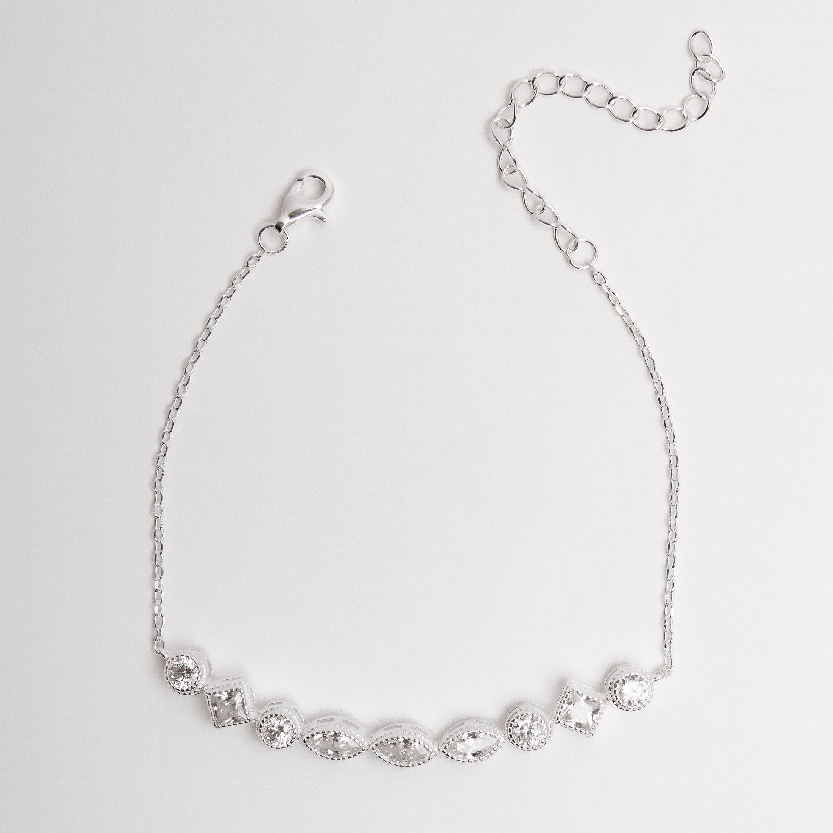 Imagem Pulseira entremeio zircônias redonda, losango e navete corrente cadeado 16+4cm